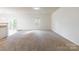 Spacious living room with neutral carpeting and natural light at 8127 Paw Club Dr, Charlotte, NC 28214