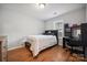 Bedroom with built-in desk and hardwood floors at 9215 Pinaceal Ct # 87, Charlotte, NC 28215