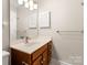 Light and bright bathroom with wood vanity and updated fixtures at 924 Cranberry Cir # 50-C, Fort Mill, SC 29715