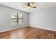 Bright bedroom with hardwood floors and large window at 924 Cranberry Cir # 50-C, Fort Mill, SC 29715
