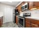 Kitchen with stainless steel appliances and wood cabinets at 924 Cranberry Cir # 50-C, Fort Mill, SC 29715