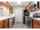 Modern kitchen features stainless steel appliances and wood cabinetry at 924 Cranberry Cir # 50-C, Fort Mill, SC 29715