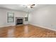 Living room featuring a stone fireplace and hardwood floors at 924 Cranberry Cir # 50-C, Fort Mill, SC 29715