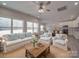 Bright and airy living room with a comfortable sofa and large windows offering natural light at 1140 Forest Dr, Marshville, NC 28103