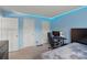 Bedroom with gaming setup, double bed, and blue walls at 13500 Kibworth Ln, Charlotte, NC 28273