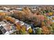 Aerial view of community, highlighting tree-lined streets and residential buildings at 19744 Feriba Pl, Cornelius, NC 28031