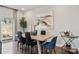 Bright dining room with a large table, sliding glass doors, and hardwood floors at 2003 Old Rivers Rd, Concord, NC 28027