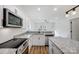 Modern kitchen with stainless steel appliances and granite countertops at 209 Westover Ave, Kannapolis, NC 28081