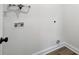 Simple laundry room with hookups and vinyl flooring at 209 Westover Ave, Kannapolis, NC 28081