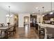 Open dining area with hardwood floors and view of kitchen and entryway at 356 Harvest Valley Ln, Fort Mill, SC 29715