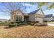 One-story house with neutral siding, attached garage, and manicured landscaping at 356 Harvest Valley Ln, Fort Mill, SC 29715