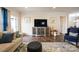 Relaxing living room with hardwood floors, a large TV, and comfortable seating at 356 Harvest Valley Ln, Fort Mill, SC 29715