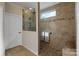 Large walk-in shower with tile surround and built-in seat at 356 Harvest Valley Ln, Fort Mill, SC 29715