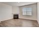 Gathering room with hardwood floors and corner fireplace at 3689 Charles Nw St, Conover, NC 28613