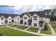 White townhouses with black roofs and white picket fences at 456 Berryman Rd, Rock Hill, SC 29732