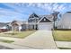 Two-story house with gray and beige siding, a white door, and a two-car garage, next to another house at 457 Shallowford Dr # 60, Rock Hill, SC 29732