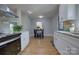 Bright dining area with hardwood floors and a small table at 8607 Larchmont Cir, Charlotte, NC 28214