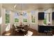 Bright breakfast nook with window views and custom chandelier at 0 S Potter Rd # 2B, Waxhaw, NC 28173