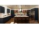 Modern kitchen with dark blue cabinetry and an island at 0 S Potter Rd # 2B, Waxhaw, NC 28173