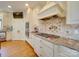 Bright kitchen with custom cabinetry, granite countertops, and a gas cooktop at 1140 Inlet Pointe Rd, Salisbury, NC 28146