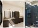 Modern bathroom with dark vanity, herringbone tile shower, and double sinks at 154A Lookout Dam Rd, Statesville, NC 28625