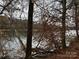 Picturesque view of the river from wooded lot at 154A Lookout Dam Rd, Statesville, NC 28625
