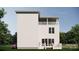 Side view of a two-story home with white siding and a deck at 155A Lookout Dam Rd, Statesville, NC 28625