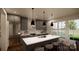 Modern kitchen with gray cabinets, white countertops, and an island at 155A Lookout Dam Rd, Statesville, NC 28625