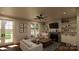 Living room with fireplace, built-in shelves, and access to a backyard at 155A Lookout Dam Rd, Statesville, NC 28625