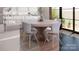 Modern dining room with round table, four chairs and large window at 156A Lookout Dam Rd, Statesville, NC 28625