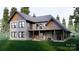 Two-story home with back patio, stone fireplace and balcony at 156A Lookout Dam Rd, Statesville, NC 28625
