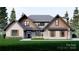 Two-story craftsman style home with stone and wood siding, and a landscaped lawn at 156A Lookout Dam Rd, Statesville, NC 28625