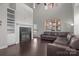 Living room with built-in shelving, fireplace and hardwood floors at 19433 Booth Bay Ct, Cornelius, NC 28031