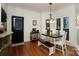 Charming breakfast nook with a farmhouse table and window seating at 215 Hobbs St, Davidson, NC 28036