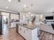 Open concept kitchen island with granite and stainless steel appliances at 2201 Silver Pine St, Concord, NC 28027