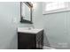 Bathroom with dark vanity, a white sink, and a mirror at 301 Wilson N St, Rock Hill, SC 29730