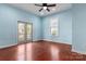 Bright bedroom with hardwood floors, french doors and ceiling fan at 301 Wilson N St, Rock Hill, SC 29730