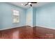 Light blue bedroom with hardwood floors and ceiling fan at 301 Wilson N St, Rock Hill, SC 29730