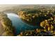 Aerial view of a community with a scenic lake at 3037 Finchborough Ct # 222, Charlotte, NC 28269