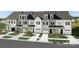 New townhouses with gray and white siding, two-car garages, and landscaping at 3037 Finchborough Ct # 222, Charlotte, NC 28269