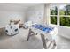 Fun game room with foosball table and comfy seating at 3037 Finchborough Ct # 222, Charlotte, NC 28269