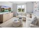 Spacious living room with L-shaped sectional sofa and large windows at 3037 Finchborough Ct # 222, Charlotte, NC 28269