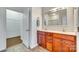 Double vanity bathroom with a large mirror and walk-in shower at 312 Garnet Ct, Fort Mill, SC 29708