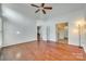 Main bedroom with hardwood floors and access to bathroom at 312 Garnet Ct, Fort Mill, SC 29708