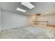 Bright bonus room featuring a ceiling fan and skylights at 312 Garnet Ct, Fort Mill, SC 29708