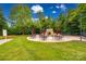 Outdoor patio area with stone fireplace and seating at 312 Garnet Ct, Fort Mill, SC 29708