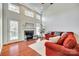 Spacious living room with hardwood floors, fireplace, and lots of natural light at 312 Garnet Ct, Fort Mill, SC 29708