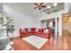 Open living room with hardwood floors, high ceilings, and access to kitchen at 312 Garnet Ct, Fort Mill, SC 29708