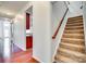 Elegant staircase with wood railing and carpeted steps at 312 Garnet Ct, Fort Mill, SC 29708