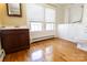 Bathroom with walk-in tub, wood floors, and updated vanity at 505 Liledoun Rd, Taylorsville, NC 28681